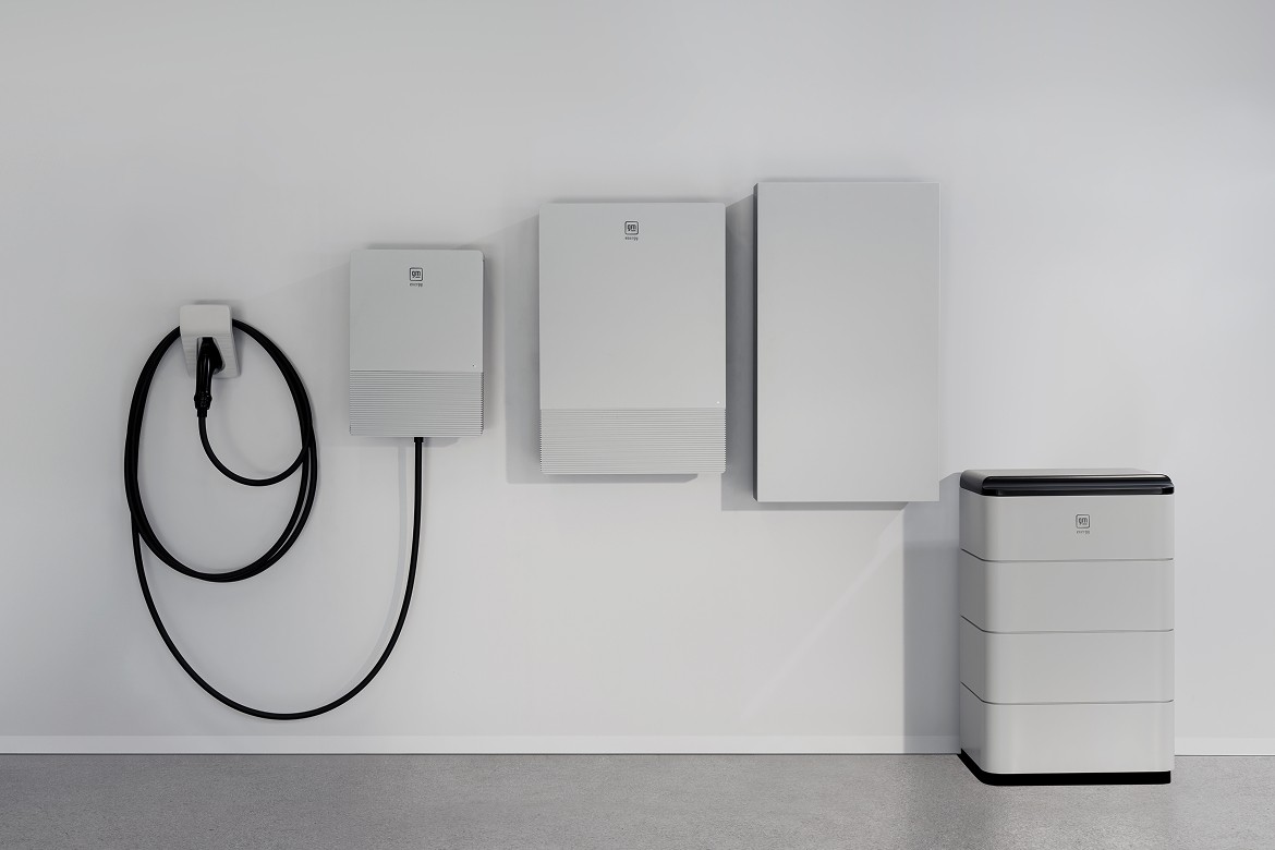 Energy-systems White modern garage interior with GM Energy wall-mounted energy management unit for home energy storage and EV charging.