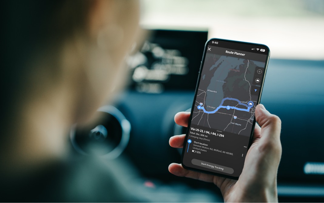 Person Holding a Smartphone With Driving Directions Displayed