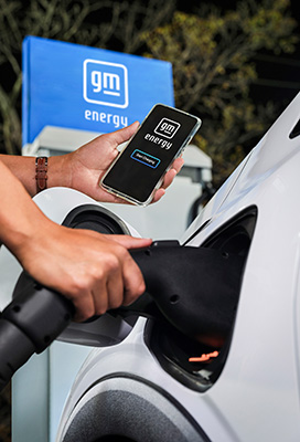Person Charging Their EV Using a Public Charging Station