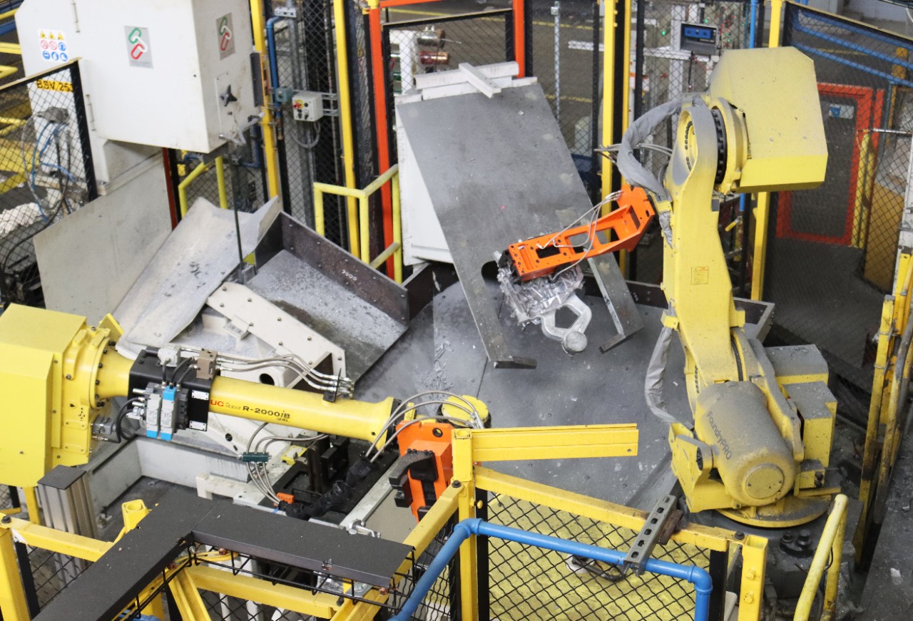 Robotic arms make and move parts