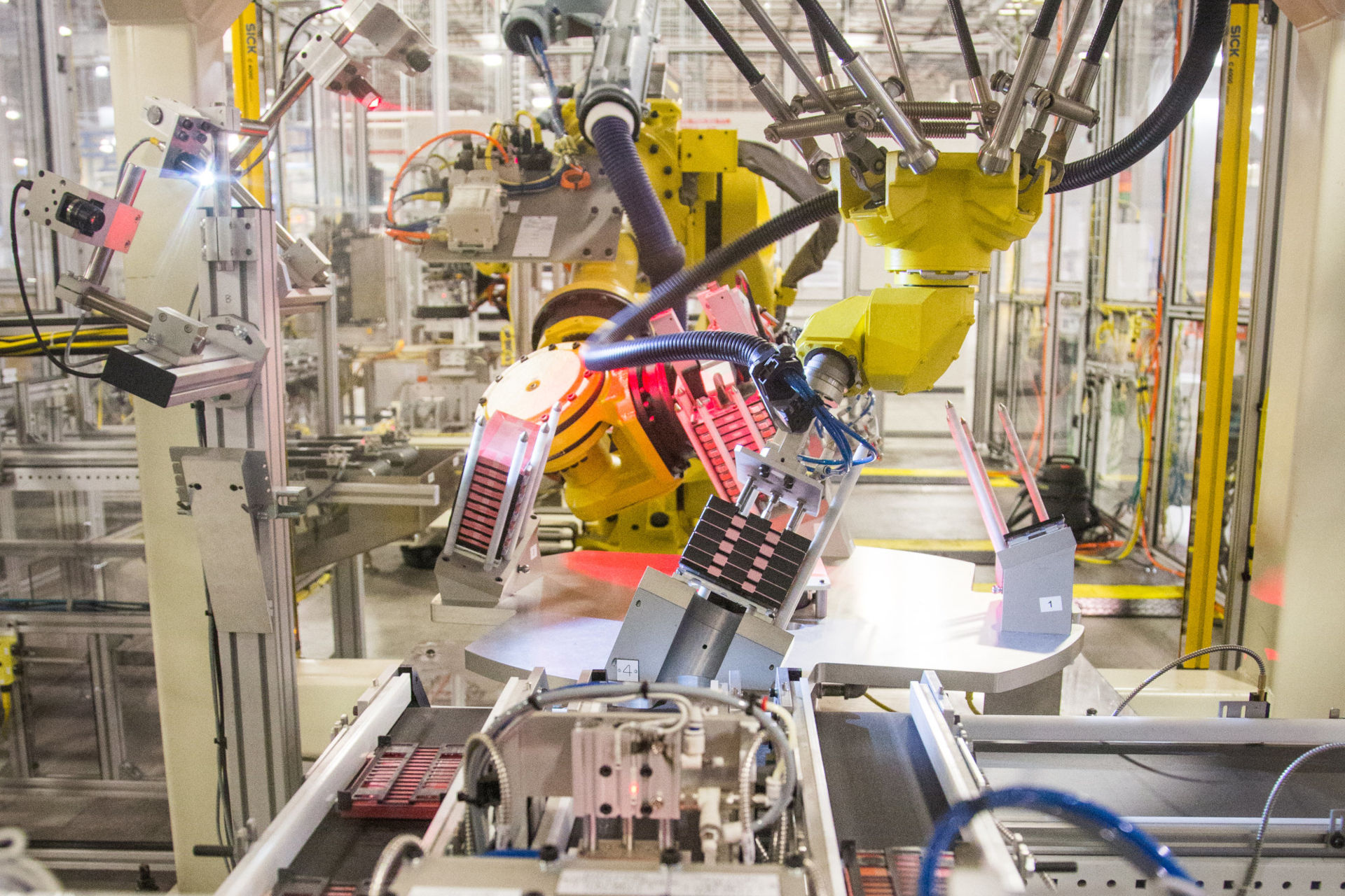 Robot production line assembles battery parts