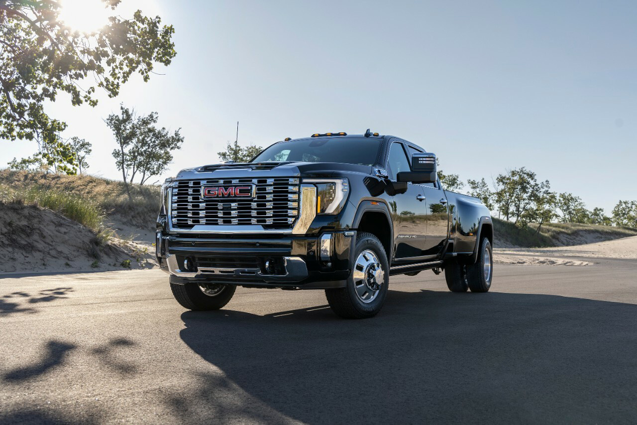 A GMC Sierra 3500 HD Denali parked on a road in dessert.