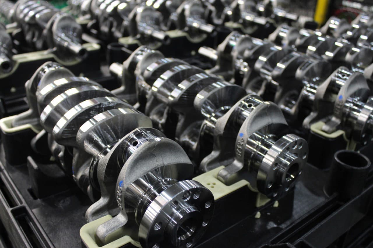 line of crankshaft assemblies ready to be put into engine