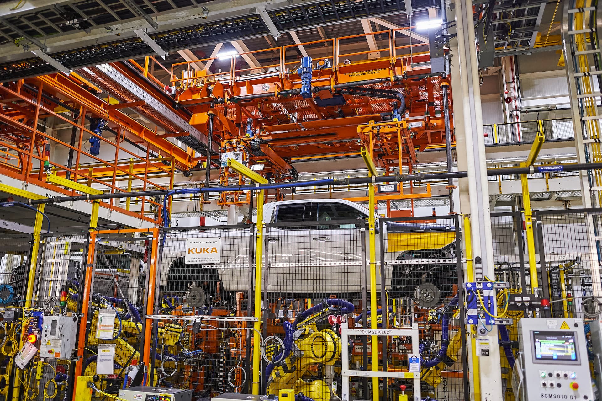 White truck on lift moves through Fort Wayne Assembly plant