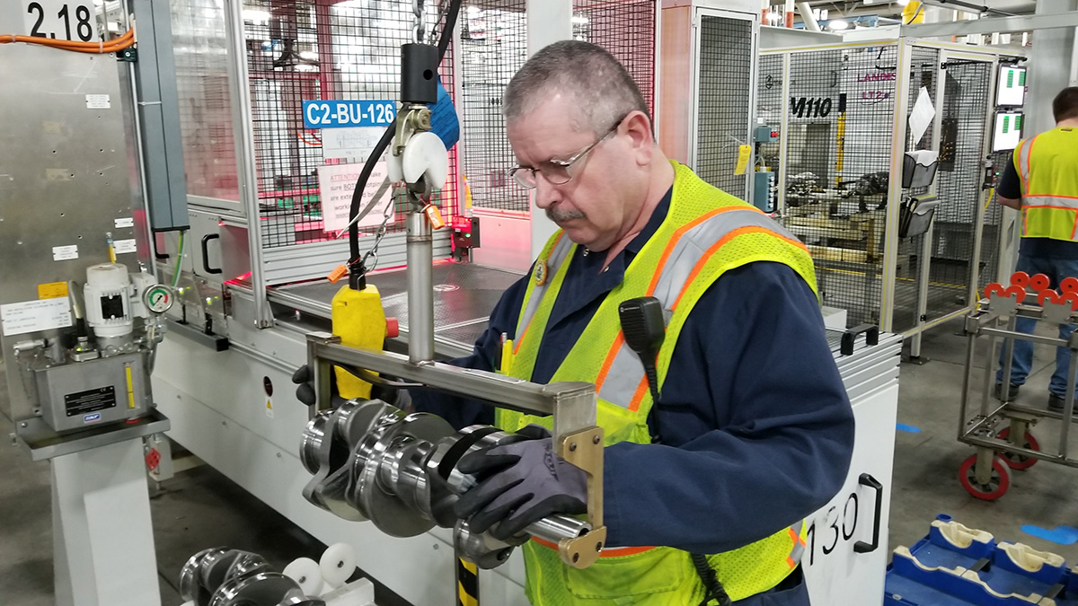 An employee working at the General Motors Romulus Propulsion Center.