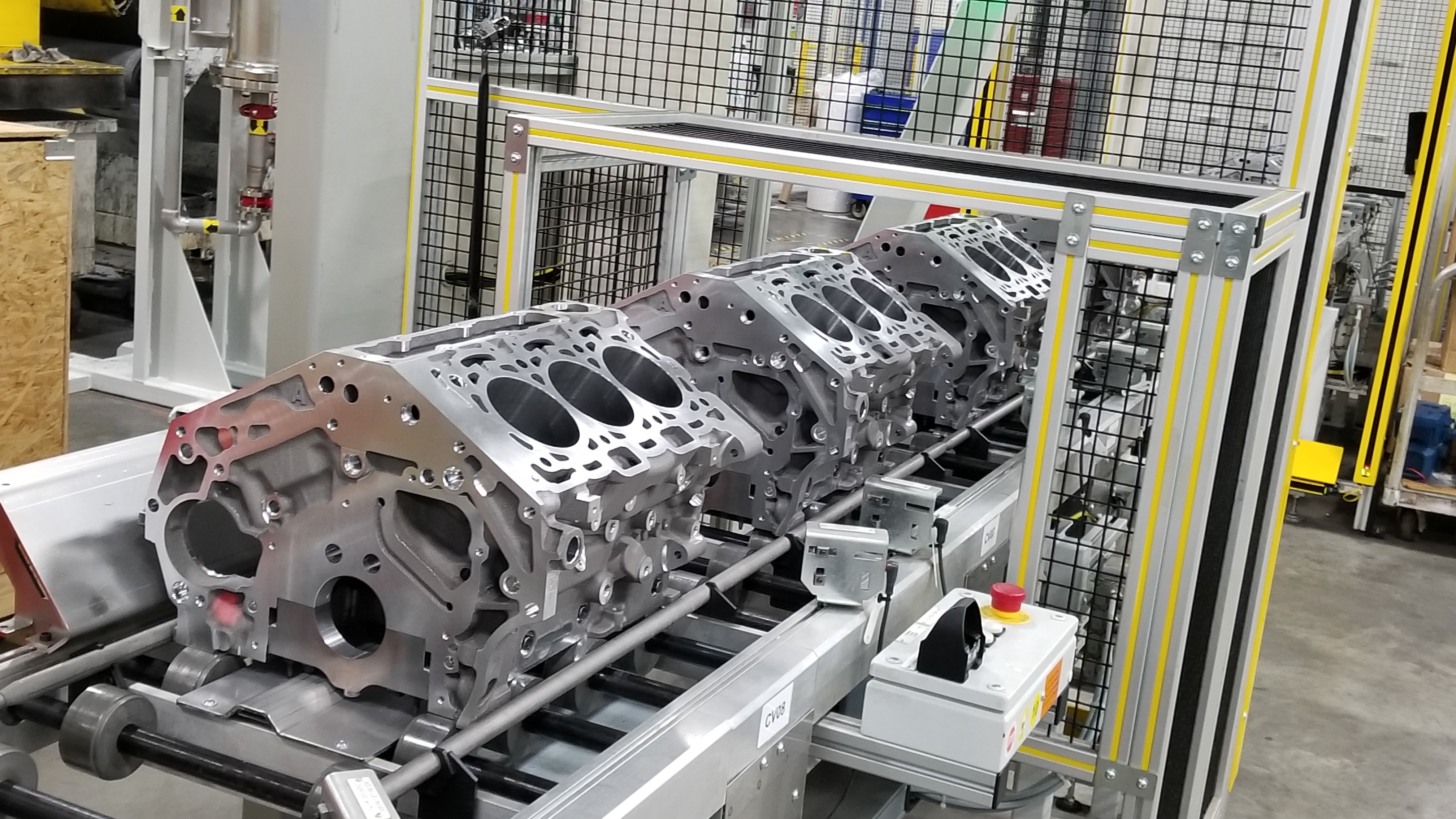 series HFV6 engine blocks move down roller assembly line to protected assembly area