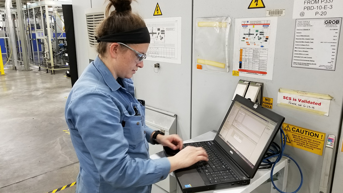 An employee working at the General Motors Romulus Propulsion Center.