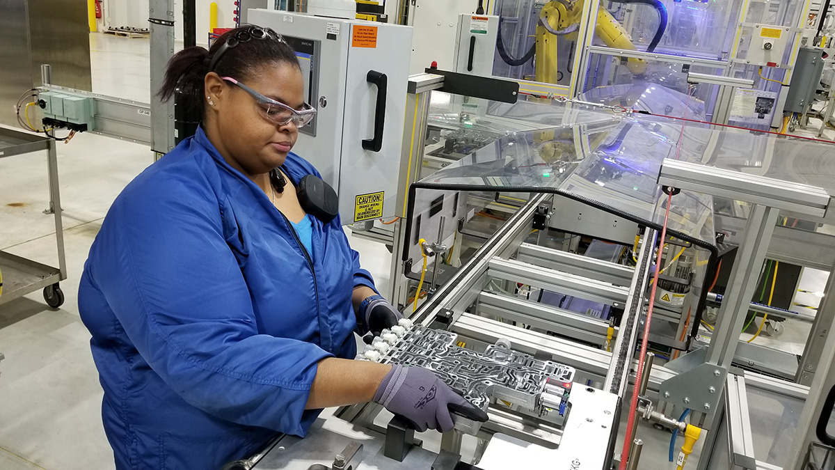 An employee working at the General Motors Romulus Propulsion Center.