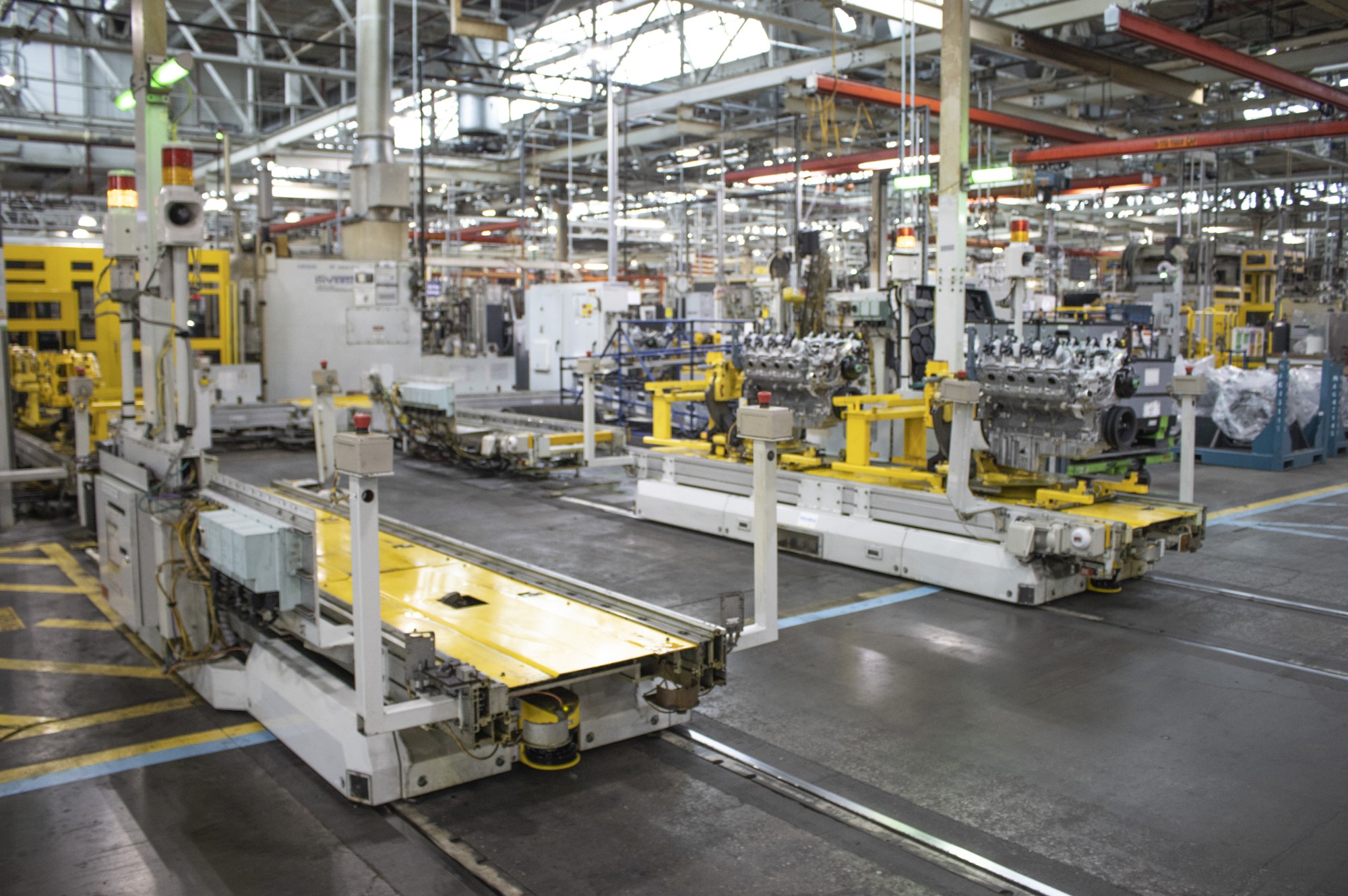 large flat pallets on rails move engine assemblies around Tonawanda Engine plant floor 