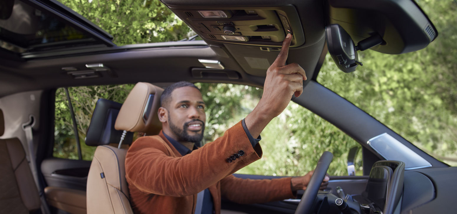 general motors strategic plan 2021 Driver Using OnStar Guardian Safety and Services Features in Car