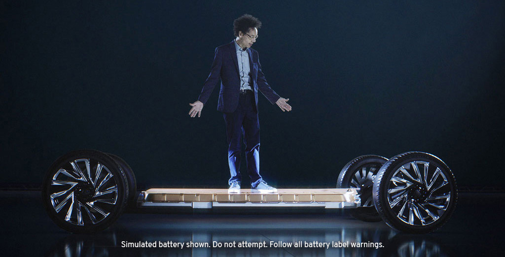 Journalist Malcolm Gladwell Standing on Top of General Motor’s Revolutionary Ultium Platform Battery. 