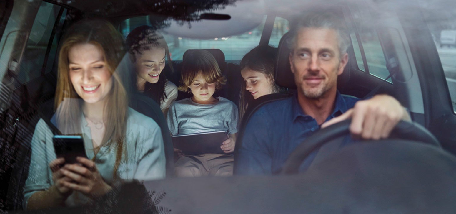 Family Driving Together on Road