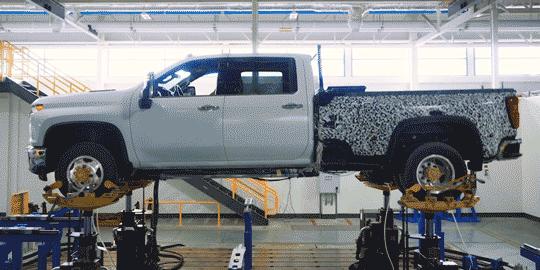 A GM Truck Being Tested on a Full Vehicle Stimulator in a Warehouse