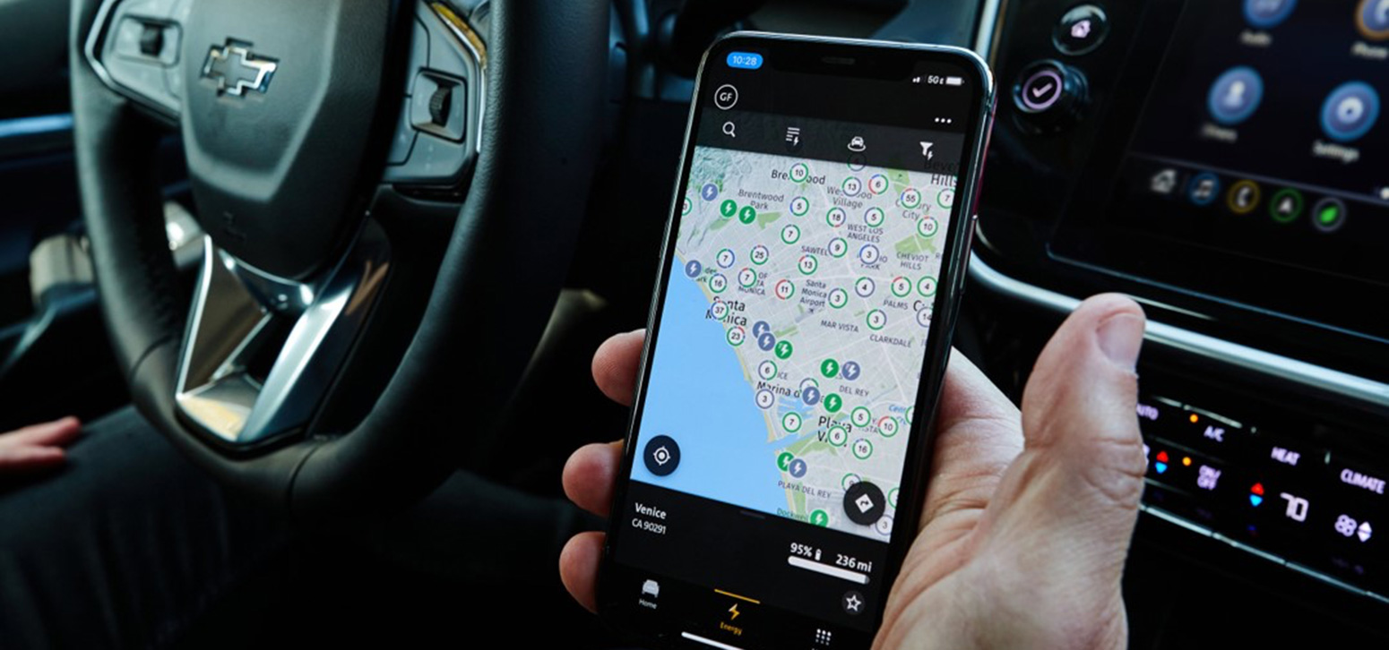 Driver Using the Ultium Charge 360 Mobile App to Find Charging Stations Nearby