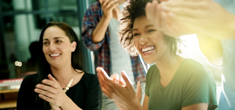 Happy people clap hands and smile