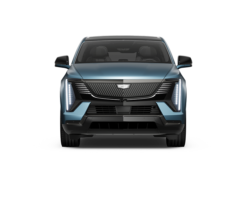 Front view of 2025 Cadillac Escalade IQ in Celestial Blue, front view showing illuminated grille and vertical LED headlamps.