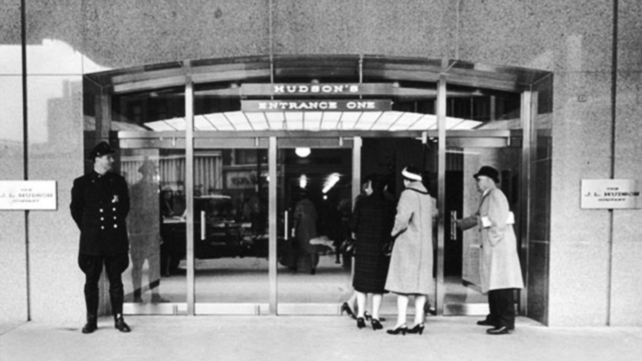 A Black and White Historical Photo of the Original Hudson's Entrance One with People Entering