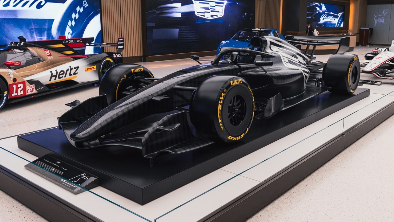 A Sleek Dark Race Car on Display at Entrance One Showcasing GM Innovation in Motorsports