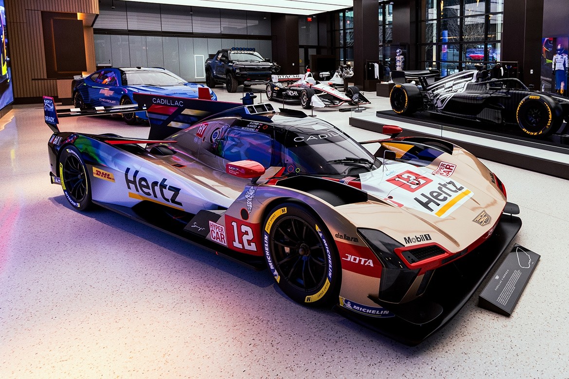 A Dynamic Cadillac Race Car with Hertz Branding on Display in the Entrance One Exhibition Space