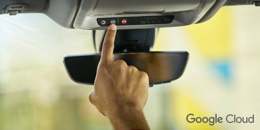 Person Pressing Onstar Button Under Rearview Window