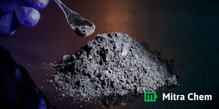 Spoon Picking Up Minerals from a Pile