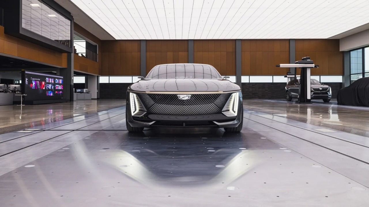 Sprawling interior view of a studio space inside GM's Design West with a physical model of a Cadillac vehicle on the floor.